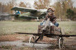 Young boy-pilot in the plane at the airport handmade autumn Young boy-pilot in the plane at the airport handmade autumn