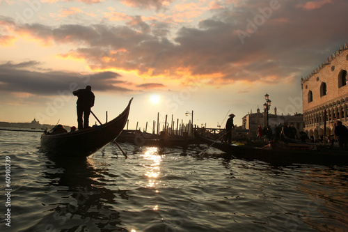  Gondola on Grand canal against sunset in Venice, Italy