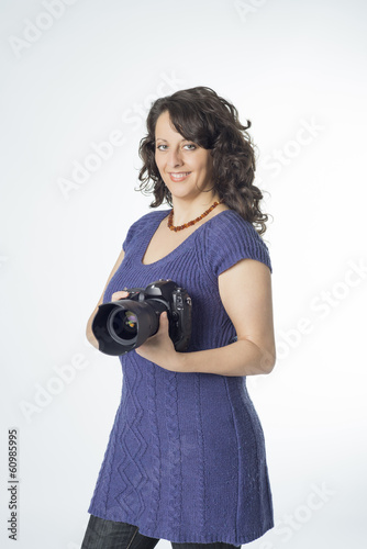 Photo: Young woman with camera Young woman with camera