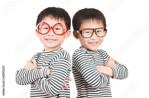 Photo: Two brother smiling on white background Two brother smiling on white background