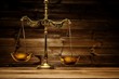 Brass scales over wooden background Brass scales over wooden background