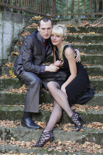 Photo: Lovely couple enjoying fall in love at park Lovely couple enjoying fall in love at park