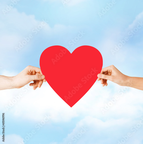 Photo: couple hands holding red heart couple hands holding red heart