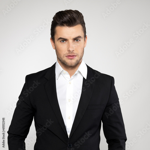 Photo: Fashion young businessman in black suit Fashion young businessman in black suit