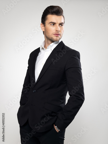 Photo: Fashion young businessman in black suit Fashion young businessman in black suit