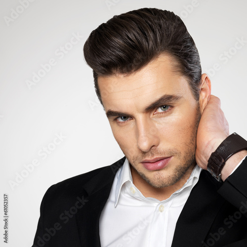 Photo: Closeup face of a fashion businessman in suit Closeup face of a fashion businessman in suit