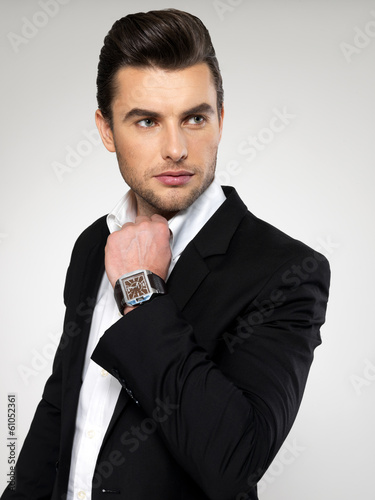 Photo: Fashion young businessman in black suit Fashion young businessman in black suit