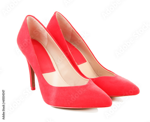 Photo: Beautiful red female shoes, isolated on white Beautiful red female shoes, isolated on white