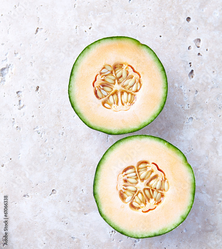 Photo: Fresh Cantaloupe on a Stone Background Fresh Cantaloupe on a Stone Background
