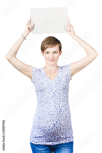 Photo: Woman with a baby bump holding a white sign Woman with a baby bump holding a white sign