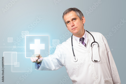 Photo: Doctor pressing modern medical type of button Doctor pressing modern medical type of button