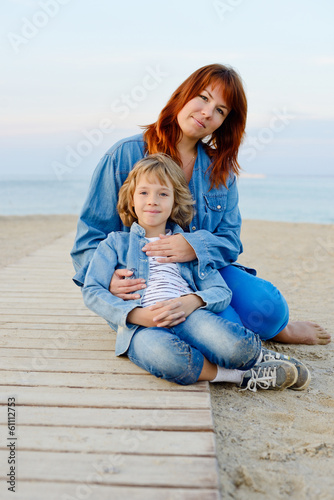 Photo: mother and daughter resting near the sea mother and daughter resting near the sea