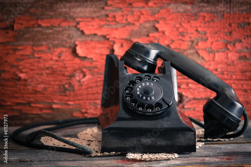 Photo: Old-fashioned rotary telephone off the hook Old-fashioned rotary telephone off the hook