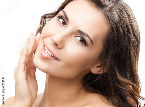 Photo: Woman touching skin or applying cream, isolated Woman touching skin or applying cream, isolated