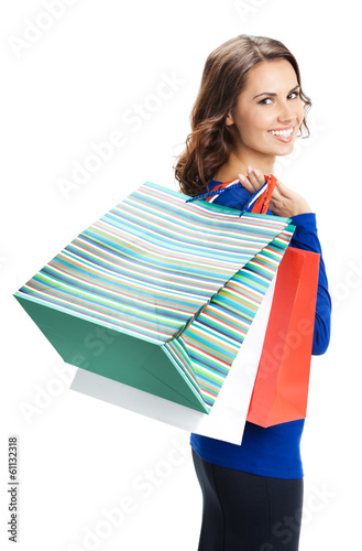 Photo: Young happy woman with shopping bags, isolated Young happy woman with shopping bags, isolated