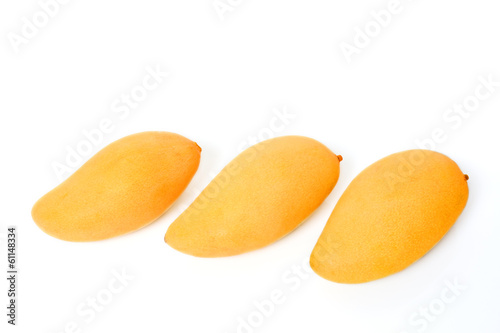 Photo: Three ripe golden mangoes Three ripe golden mangoes