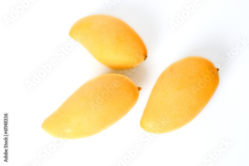Photo: Three ripe golden mangoes Three ripe golden mangoes