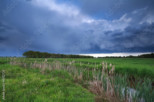 Photo: dark stormy sky over river dark stormy sky over river