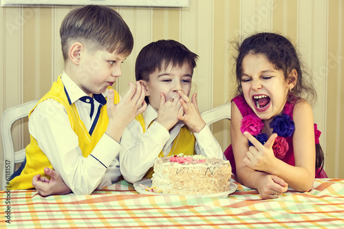 Photo: kids have fun eating birthday cake kids have fun eating birthday cake