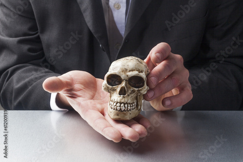 Photo: symbol of pychotherapy with skull in hands of professionals symbol of pychotherapy with skull in hands of professionals