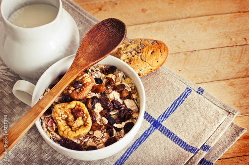 Photo: healthy breakfast background/ bowl of oat flake with raisins healthy breakfast background/ bowl of oat flake with raisins