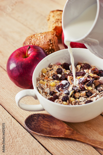 Photo: healthy breakfast background/ bowl of oat flake with raisins healthy breakfast background/ bowl of oat flake with raisins