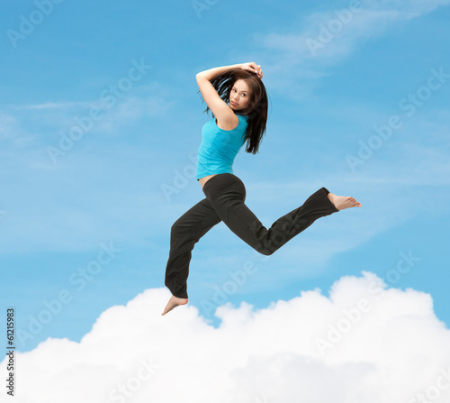 Photo: sporty woman jumping in sportswear sporty woman jumping in sportswear