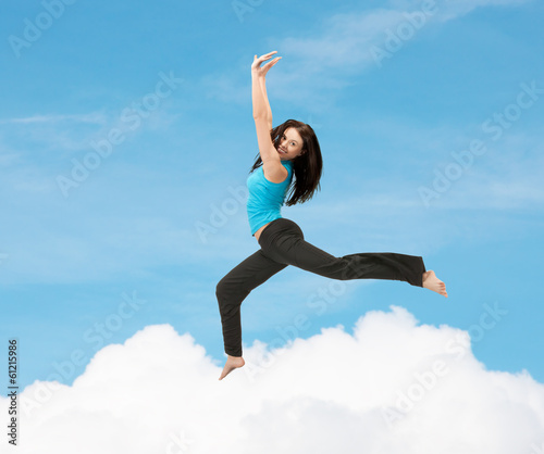 Photo: sporty woman jumping in sportswear sporty woman jumping in sportswear