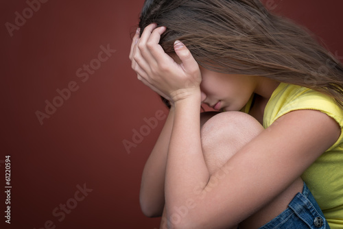 Photo: Sad teenage girl crying (with space for text) Sad teenage girl crying (with space for text)