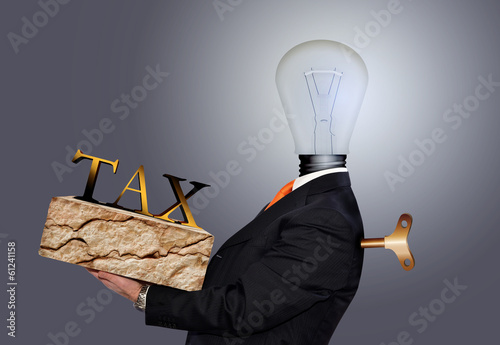 Photo: man who carries the burden of taxes man who carries the burden of taxes