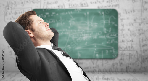 Photo: man sitting in office man sitting in office