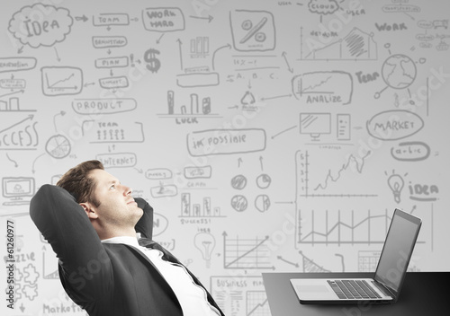 Photo: businessman sitting in office businessman sitting in office