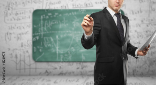 Photo: man drawing formula man drawing formula