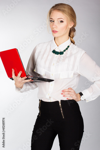Photo: Portrait of business woman with a laptop Portrait of business woman with a laptop