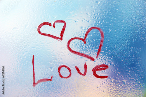 Photo: Inscription lipstick on glass on bright background Inscription lipstick on glass on bright background