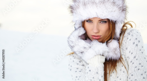 Photo: Attractive young woman in wintertime outdoor Attractive young woman in wintertime outdoor