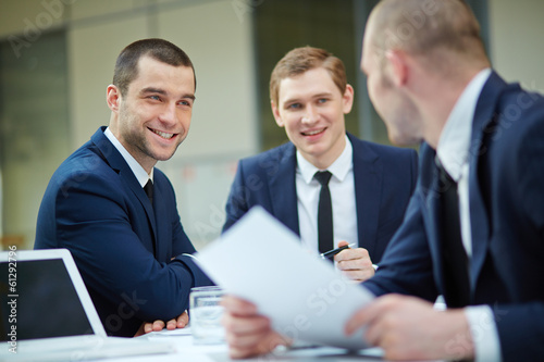 Photo: Businessmen interacting Businessmen interacting