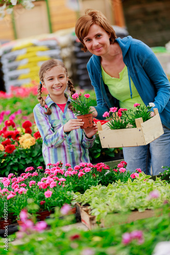 Photo: Garden center, Family shopping plants and flowers Garden center, Family shopping plants and flowers