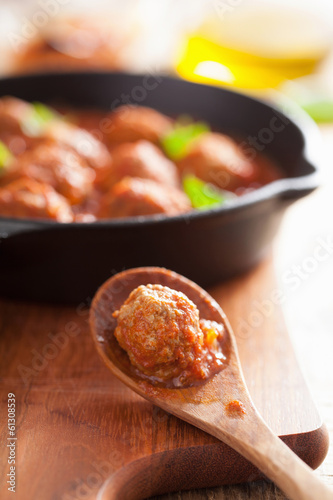 Photo: meatball with tomato sauce in spoon meatball with tomato sauce in spoon