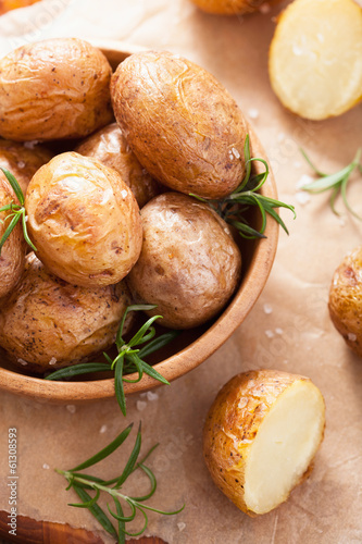 Photo: baked potatoes in wooden bowl baked potatoes in wooden bowl