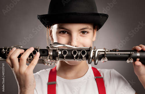Photo: little girl playing clarinet little girl playing clarinet