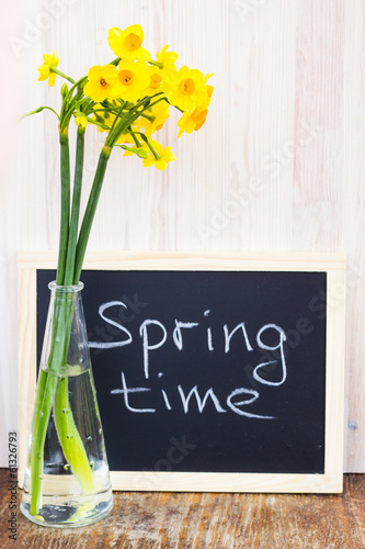 Photo: Bouquet of yellow lent lilly (daffodil) on a wooden surface Bouquet of yellow lent lilly (daffodil) on a wooden surface