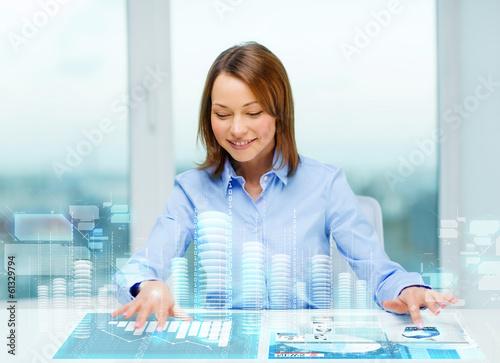 Photo: woman pointing to buttons on virtual screen woman pointing to buttons on virtual screen