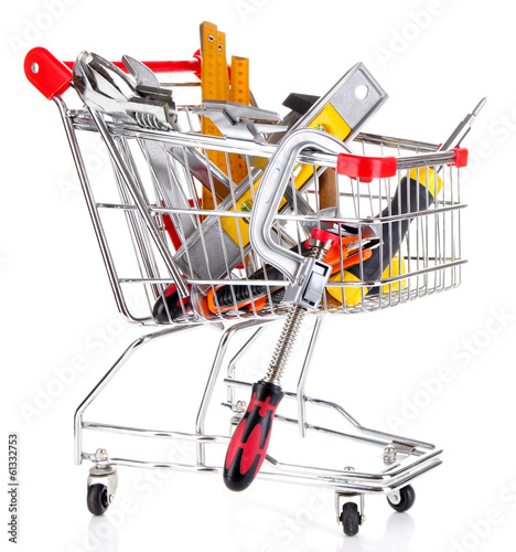 Photo: Construction tools in shopping cart isolated on white Construction tools in shopping cart isolated on white