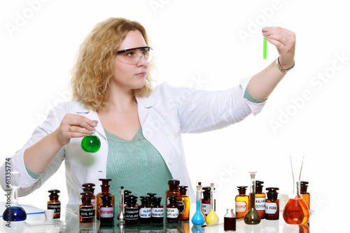 Photo: chemist woman with chemical glassware flask isolated chemist woman with chemical glassware flask isolated