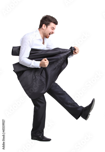 Photo: Smart businessman rocking it off playing airguitar Smart businessman rocking it off playing airguitar