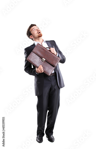 Photo: Business man with briefcase standing on white background Business man with briefcase standing on white background
