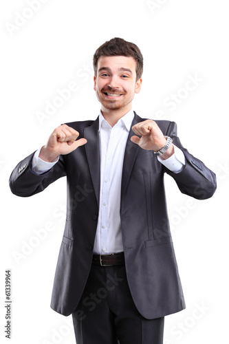 Photo: Happy smiling young business man with thumbs up gesture Happy smiling young business man with thumbs up gesture