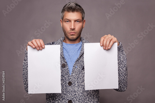 Photo: holding blank papers holding blank papers