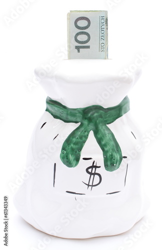 Photo: Moneybox and banknote on white background Moneybox and banknote on white background